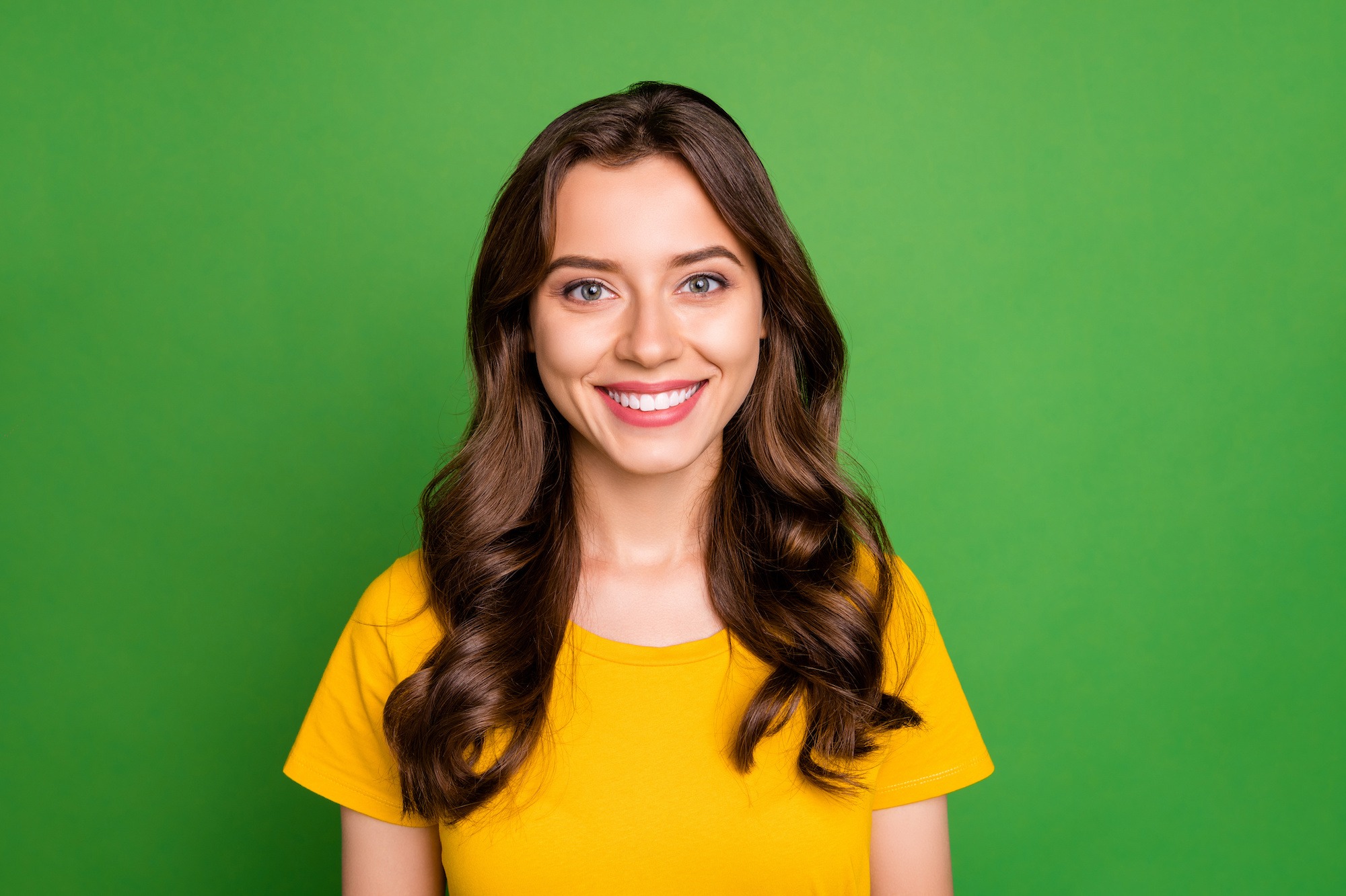 Close-up portrait of her she nice attractive lovely pretty cute cheerful cheery wavy-haired girl college high school student isolated over bright vivid shine vibrant green color background new york braces